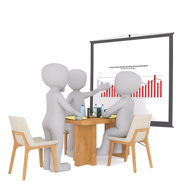 Grupo de personas debatiendo acerca de un gráfico proyectado en una pantalla